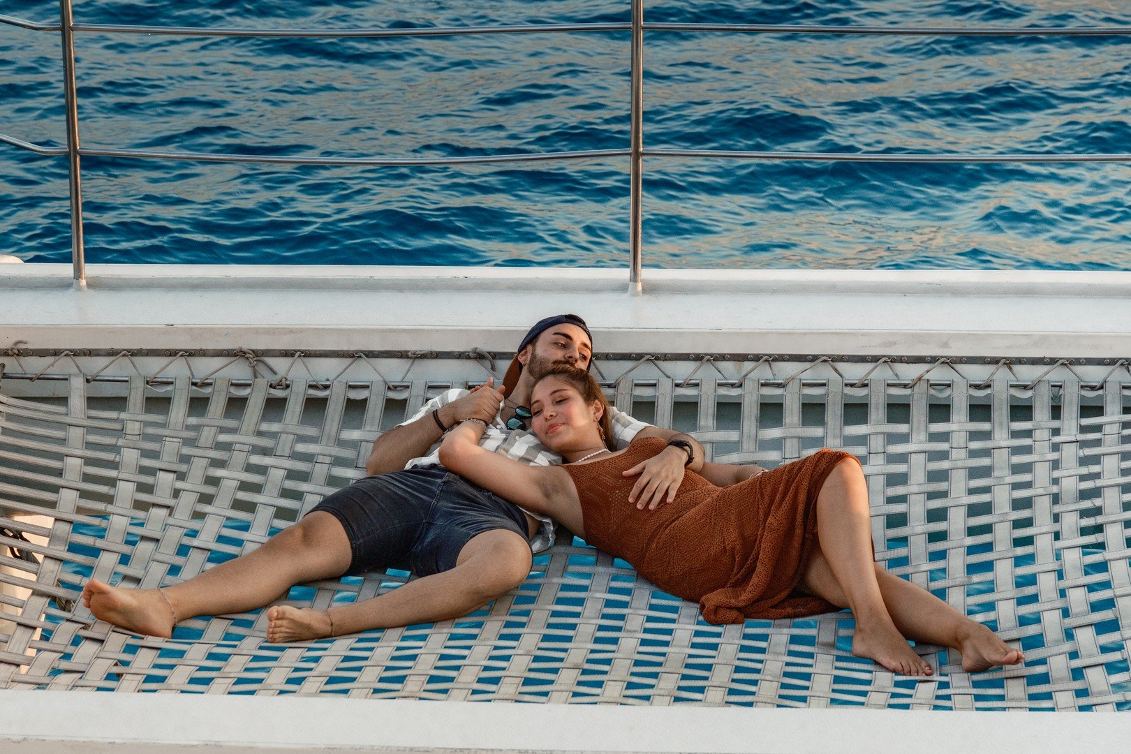 Couple Catamaran Sunset